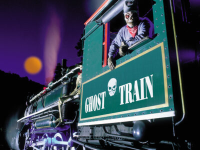 Ghost Train engineer peering out from the cab of the Ghost Train at Tweetsie Railroad, Blowing Rock, North Carolina